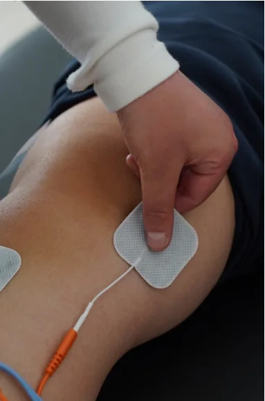 Electrode pads placed for drug-free pain relief therapy