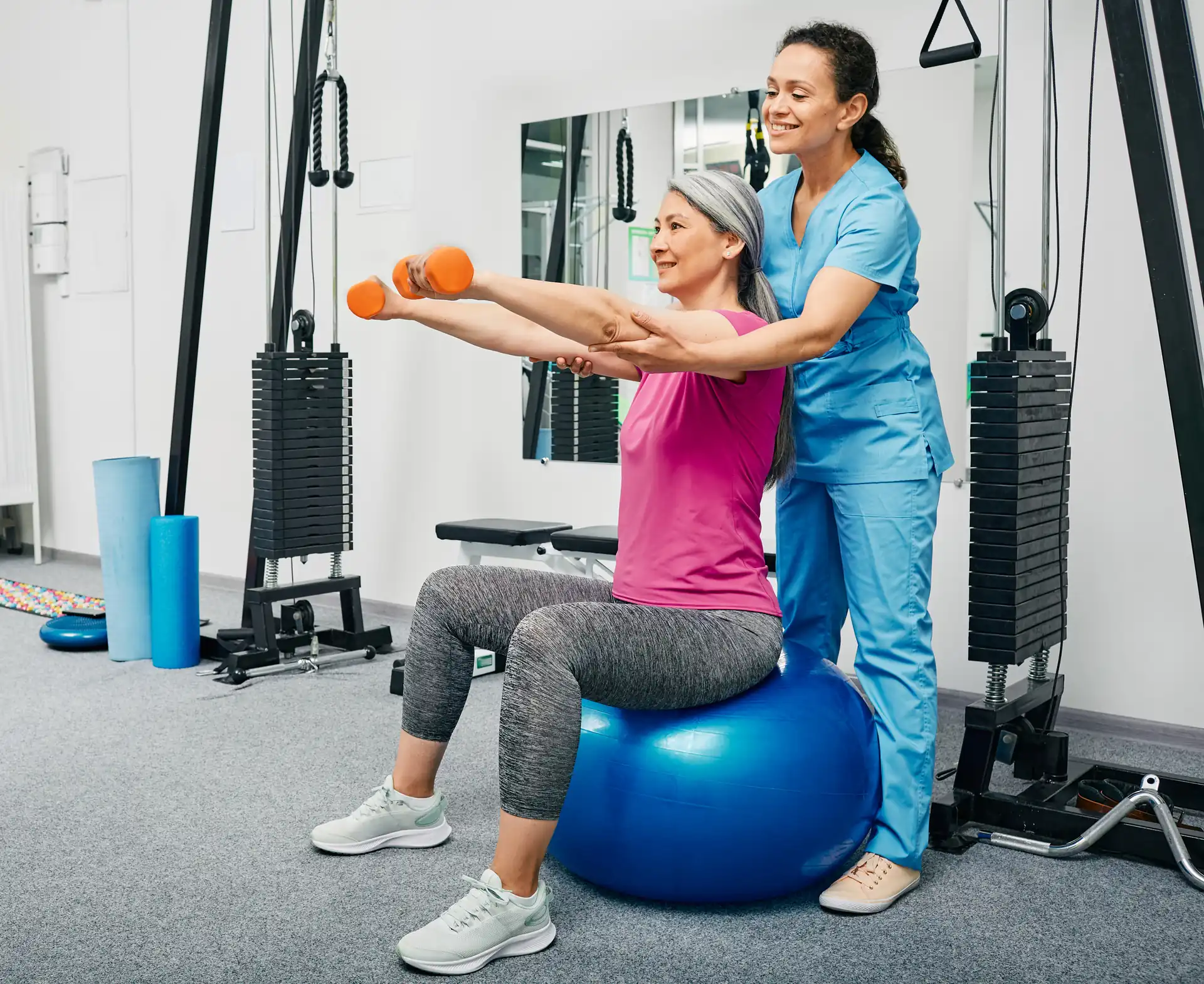 A clinician guiding a patient through post-op recovery movement